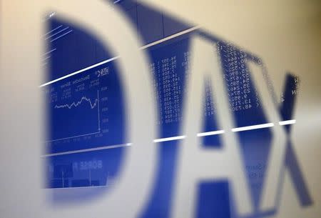 The German share price index DAX board is reflected in a DAX sign, at the stock exchange in Frankfurt September 16, 2013. REUTERS/Kai Pfaffenbach/Files