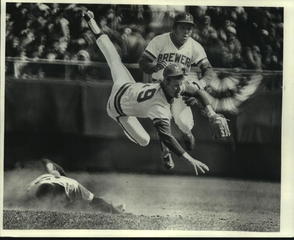 Robin Yount goes airborne in 1974, the season when he debuted at age 18 as the Brewers' opening-day shortstop.