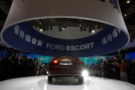 The Ford Escort sedan is unveiled during press day at the China Auto show in Beijing, China, Sunday, April 20, 2014. Ford Motor Co. on Sunday unveiled the new Escort sedan designed in China for global sale at a Beijing auto show that highlighted the growing influence of Chinese tastes on the industry. (AP Photo/Ng Han Guan)