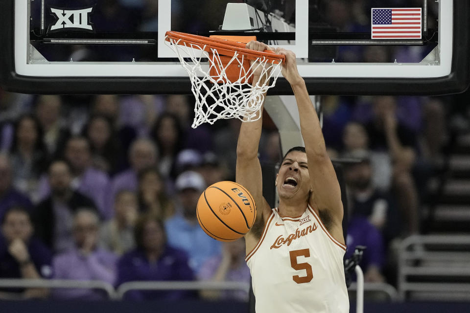 Texas forward Kadin Shedrick dunks the ball during the first half of an NCAA college basketball game against Kansas State Wednesday, March 13, 2024, in Kansas City, Mo. (AP Photo/Charlie Riedel)