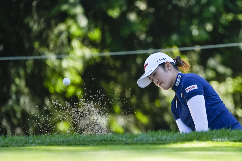 Mone Inami, of Japan, hits out of the bunker on the fourth hole during a practice round for the Women's PGA Championship golf tournament at Sahalee Country Club, Wednesday, June 19, 2024, in Sammamish, Wash. (AP Photo/Gerald Herbert)