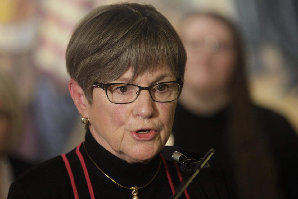 FILE - Kansas Gov. Laura Kelly speaks to reporters during a news conference, Tuesday, April 25, 2023, at the Statehouse in Topeka, Kan. Kelly and legislative leaders were required by law to sign off on a legal settlement between the state and a fitness studio owner whose business was forced to shut down in the early months of the coronavirus pandemic. (AP Photo/John Hanna, File)