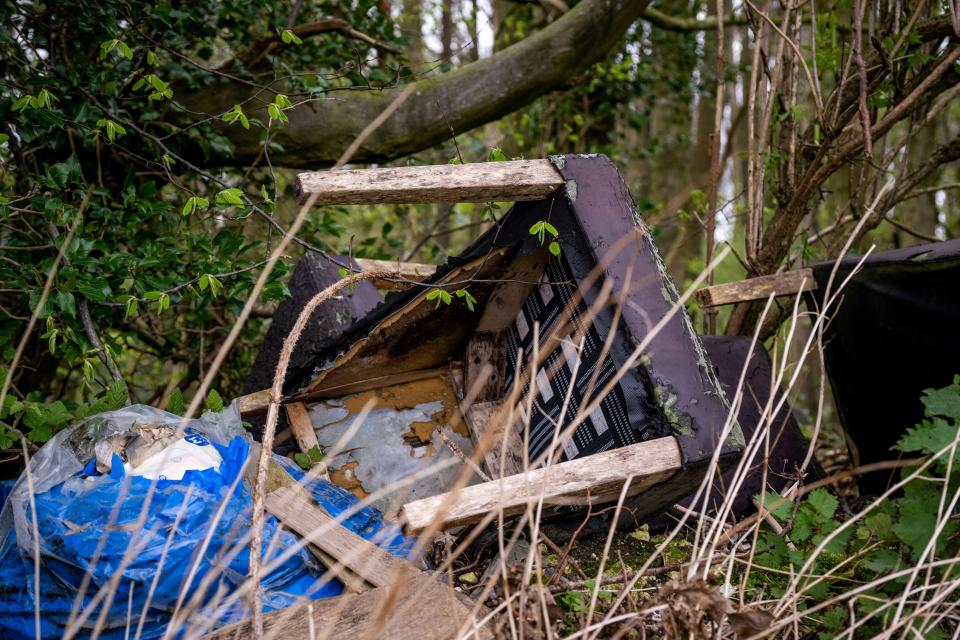 The area is littered with broken vehicles and waste. (SWNS)