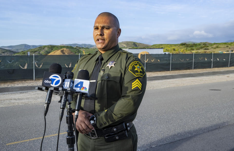 Sgt. Frank Gonzalez, public information officer with the Orange County Sheriff's Department, speaks during a news conference along Magazine Road near the intersection of Irvine Boulevard in Irvine, Calif. Wednesday evening, March 13, 2024. An explosion during an indoor training exercise Wednesday sent 16 members of Southern California's Orange County Sheriff’s Department SWAT team to the hospital, with one person requiring surgery for a leg injury, the department said. (Mark Rightmire/The Orange County Register via AP)