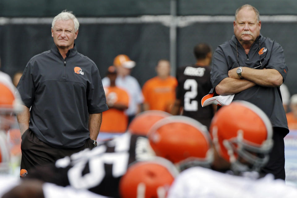 FILE - In this Aug. 21, 2012, file photo, Cleveland Browns president Mike Holmgren, right, watches practice with new owner Jimmy Haslam during training camp at the NFL football team's practice facility in Berea, Ohio. The sale of the Cleveland Browns to Haslam III was unanimously approved by NFL owners Tuesday, and Holmgren will be leaving the Browns at the end of the season. (AP Photo/Mark Duncan, File)