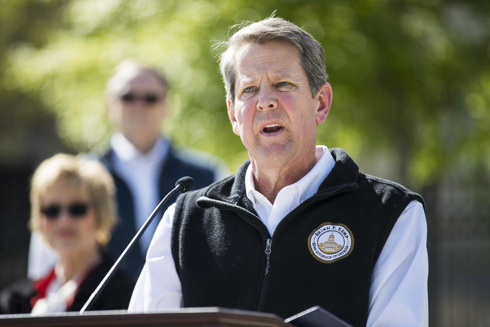 FILE - In this Wednesday, April 1, 2020 file photo, Georgia Gov. Brian Kemp speaks during a news conference at Liberty Plaza across the street from the Georgia state Capitol building in downtown Atlanta. Kemp is in a very public battle with Shirley Sessions, who was sworn in barely three months ago as mayor of Tybee Island, a small coastal community that thrives on beach tourism, after he reversed the city's painful decision to close its own beach to slow the coronavirus. (Alyssa Pointer/Atlanta Journal-Constitution via AP, File)