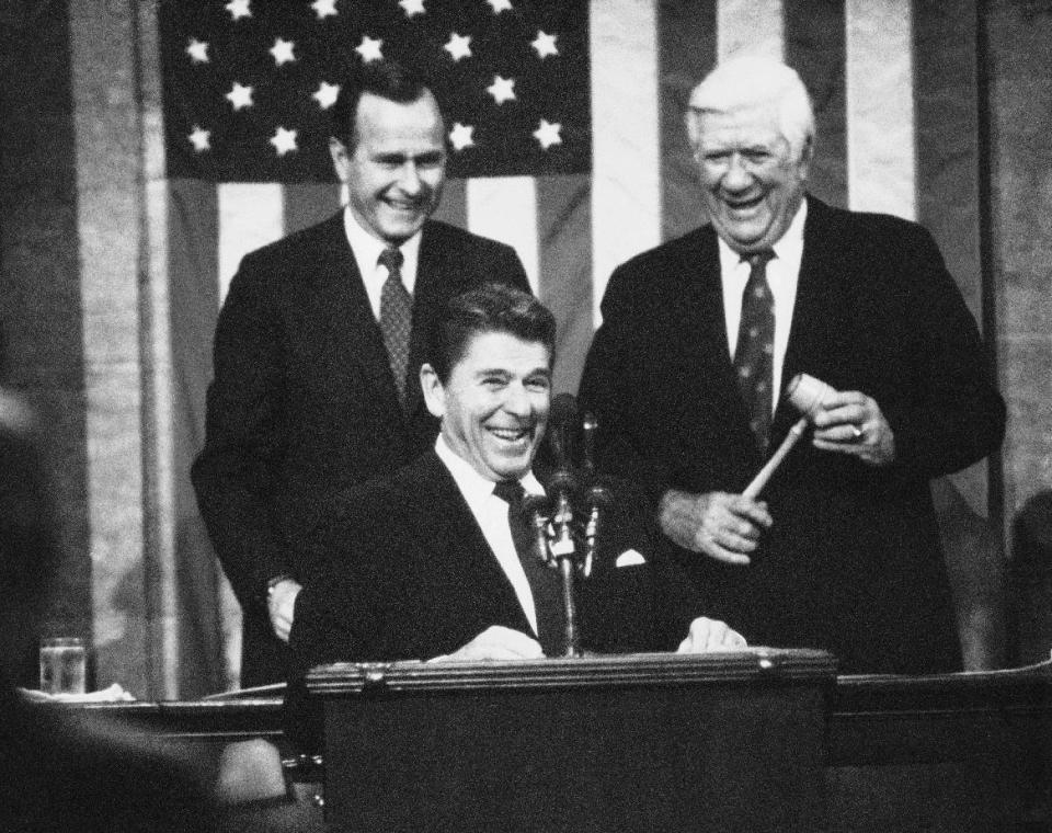 FILE - This Jan. 25, 1983 file photo shows President Ronald Reagan receiving applause prior to making his State of the Union Address on Capitol Hill in Washington. Is “strong” losing its strength? Presidents of both parties have long felt compelled to sum up the state of the union with a descriptive word or two in their State of the Union addresses. Mostly the same word. For many years now, “strong” has been the go-to adjective. Vice President George Bush is at left, House Speaker of the House Thomas P. O'Neill Jr. of Mass. is at right. (A Photo/Bob Daugherty, File)