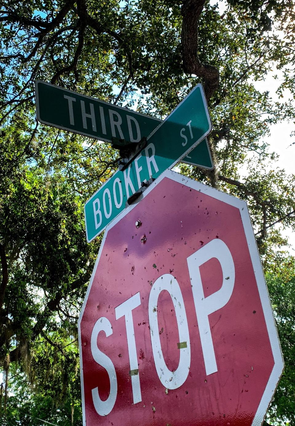 Many bullet holes could be seen on signs, windows and vehicles  outside a home in Titusville. No police or residents were out Thursday morning.