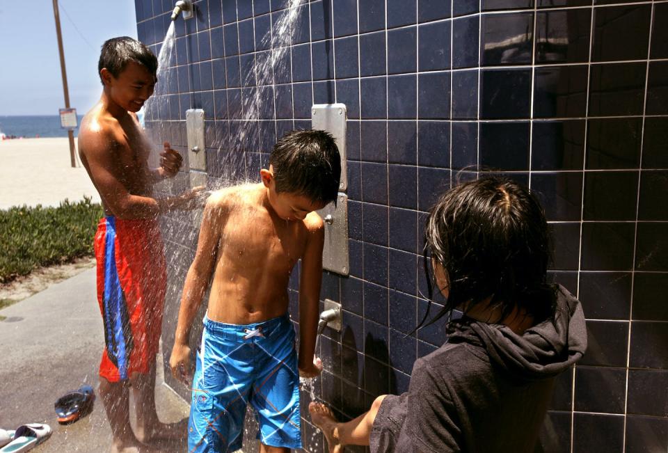 In 2015, California temporarily shut off showers at state beaches to conserve water, a strategy that mainly affected less affluent households. <a href="https://www.gettyimages.com/detail/news-photo/ryanh-morales-from-left-and-his-brother-dereck-use-the-news-photo/480116758" rel="nofollow noopener" target="_blank" data-ylk="slk:Genaro Molina/Los Angeles Times via Getty Images;elm:context_link;itc:0;sec:content-canvas" class="link ">Genaro Molina/Los Angeles Times via Getty Images</a>