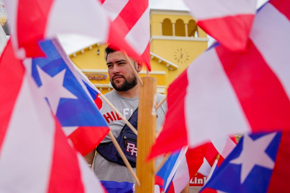 People enjoy music, food, shopping and a parade during the 4th annual Treasure Coast Puerto Rican Day Parade & Festival Saturday, Dec. 11, 2021, at the MIDFLORIDA Event Center in Port St. Lucie. 