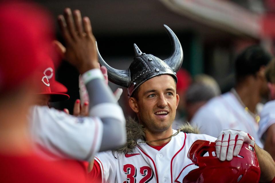 Reds first baseman Jason Vosler celebrates in the dugout after hitting a home run in the fourth inning against the Cubs on Tuesday.