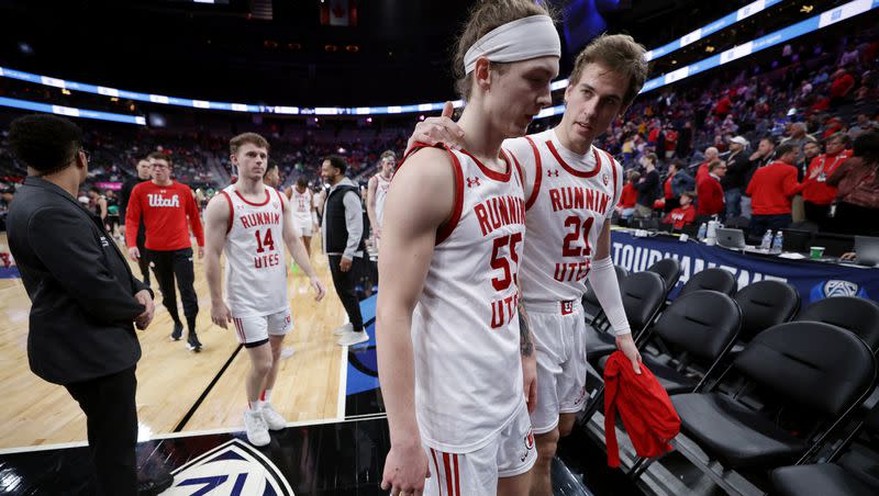 Utah Utes guard Gabe Madsen (55) talks with teammate Luka Tarlac (21) as they walk off the floor after Utah lost to Stanford in Pac-12 Tournament at T-Mobile Arena in Las Vegas on Wednesday, March 8, 2023. Stanford won 73-62.