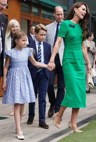 <p>Victoria Jones - WPA Pool/Getty</p> Kate Middleton with Princess Charlotte, Prince George and Prince William at Wimbledon 2023