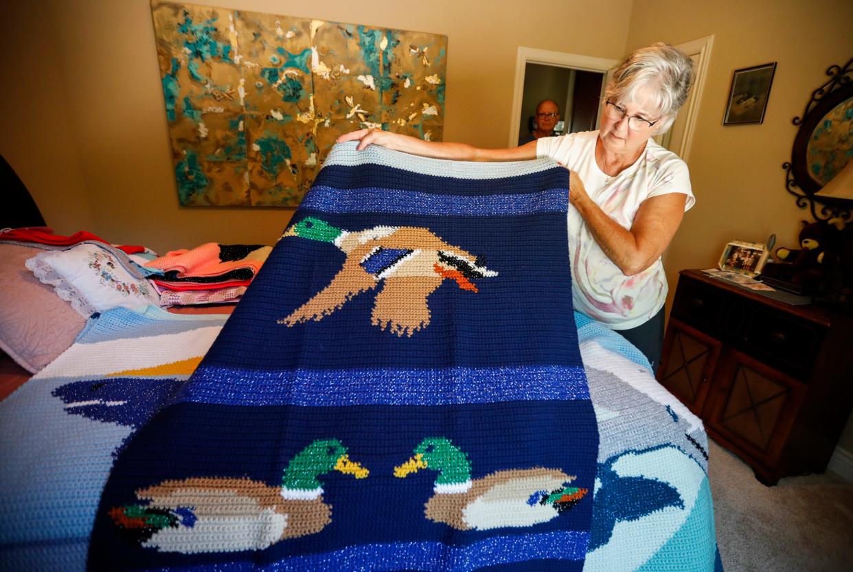 Dottie Lash shows a duck blanket she crocheted on Thursday, June 13, 2024.