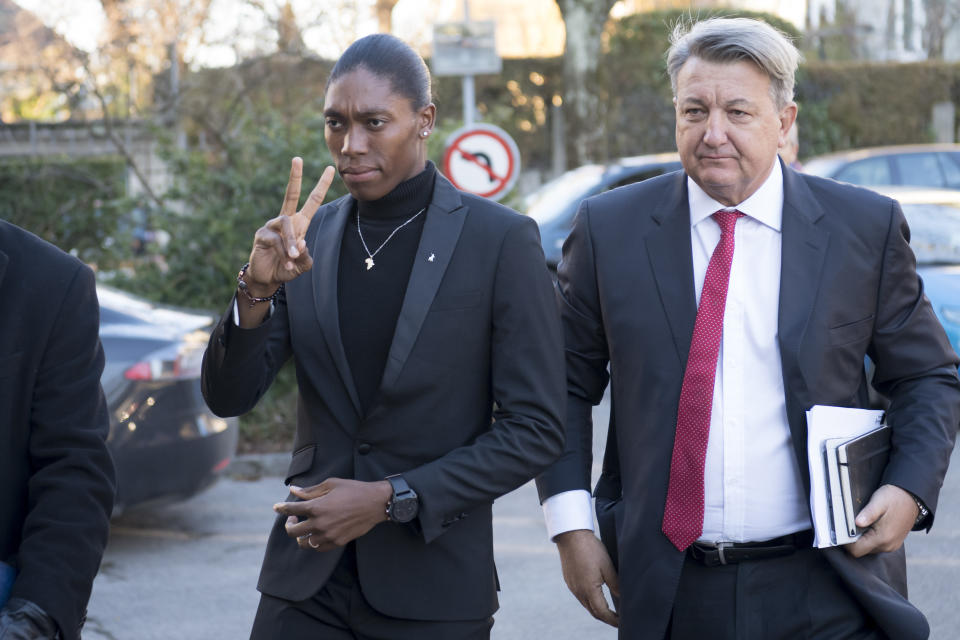 FILE - In a Monday, Feb. 18, 2019 file photo, South Africa's runner Caster Semenya, left, current 800-meter Olympic gold medalist and world champion, and her lawyer Gregory Nott, right, arrive for the first day of a hearing at the international Court of Arbitration for Sport, CAS, in Lausanne, Switzerland. On the 10th anniversary of Semenya blowing away the field in the 800 at the 2009 World Championships in Berlin, she won't comply with the International Association of Athletics Federations' latest version of a regulation to lower her level of natural testosterone.(Laurent Gillieron/Keystone via AP, File)