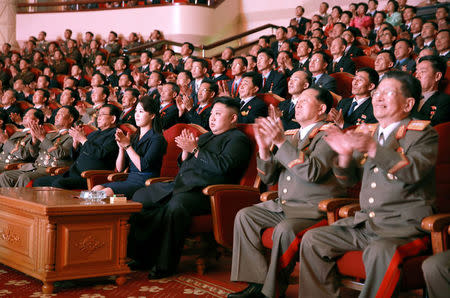 North Korean leader Kim Jong Un claps during a celebration for nuclear scientists and engineers who contributed to a hydrogen bomb test, September 2017. KCNA via REUTERS