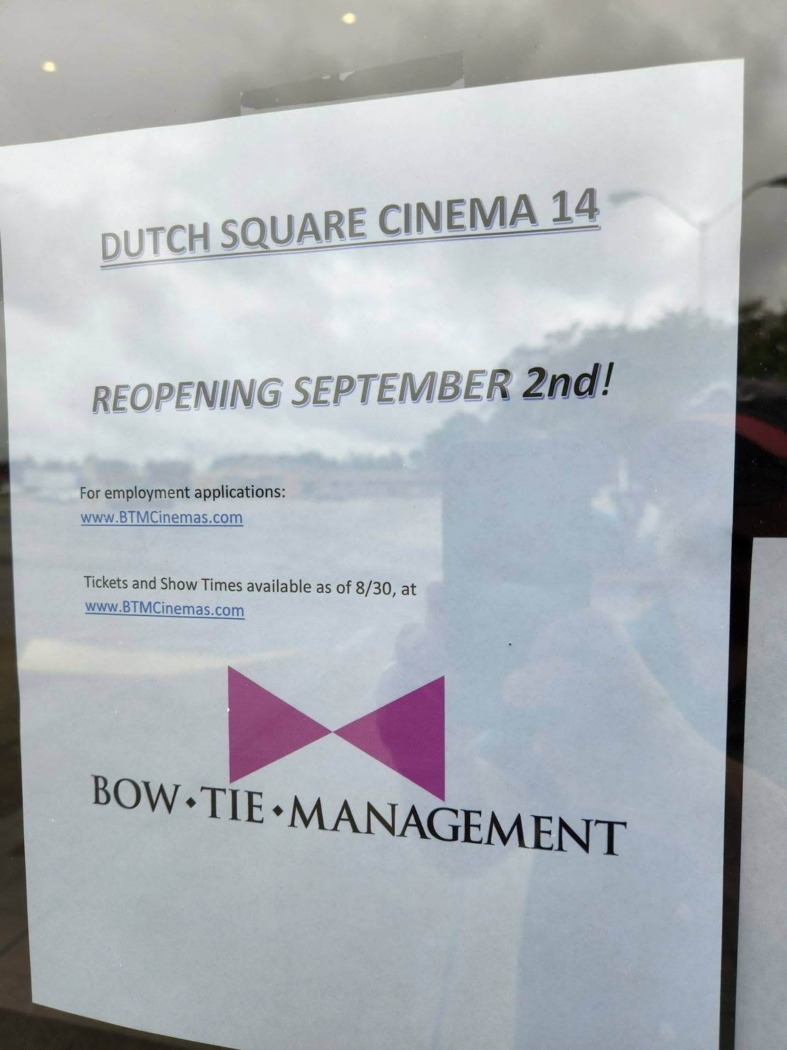 A sign at the AMC Dutch Square 14 cinema, which recently closed, indicates it will be reopened in September by a different company, Bow Tie Management.