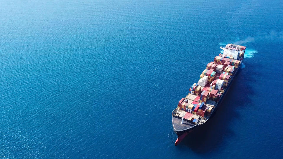 A large container ship sailing in the ocean.