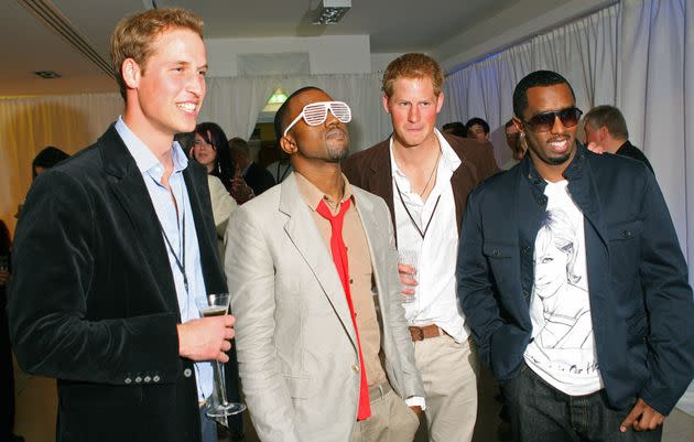 Prince Harry and his brother, Prince William, pose with rappers Sean 