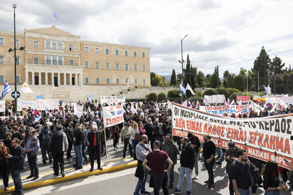 Protesters take part in a rally following a train collision in central Greece, in front of the parliament, in Athens, Sunday, March 12, 2023. Thousands of people protested Sunday against safety deficiencies in Greece's railway network and to demand the punishment of those responsible for the deadliest accident in the country's history, which killed 57 on Feb. 28, when a freight train and a passenger train that had been mistakenly directed to the same track collided head-on in central Greece. (AP Photo/Yorgos Karahalis)