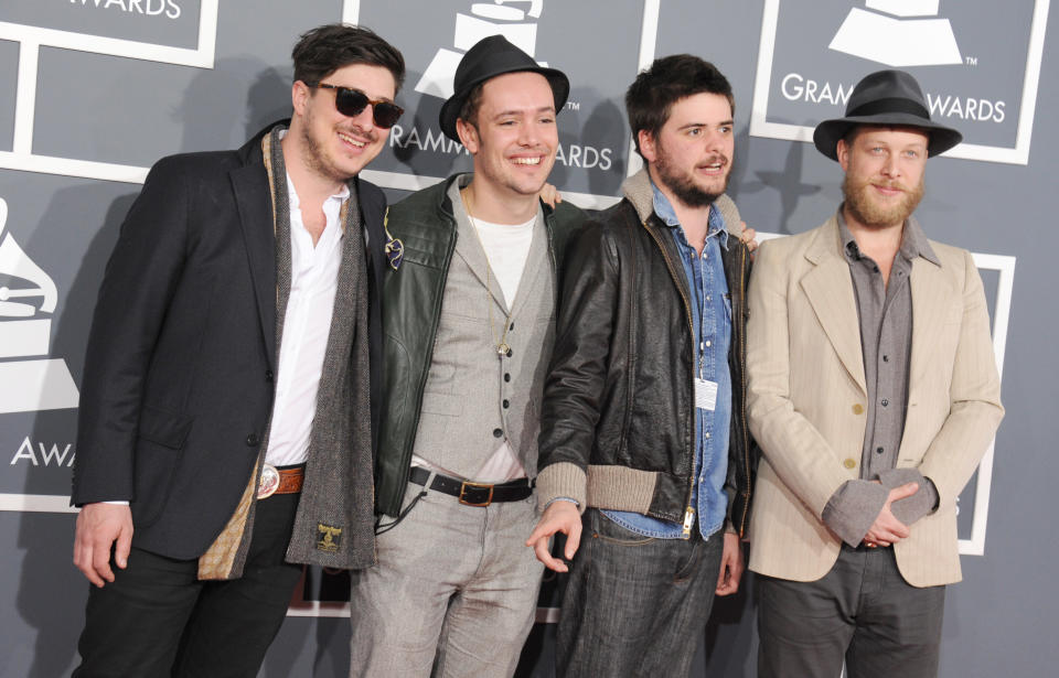 From left, Marcus Mumford, Ben Lovett, Country Winston and Ted Dwane, of musical group Mumford & Sons, arrive at the 55th annual Grammy Awards on Sunday, Feb. 10, 2013, in Los Angeles. (Photo by Jordan Strauss/Invision/AP)