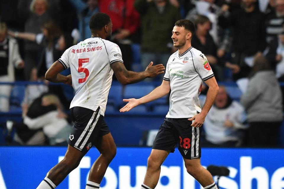 Aaron Collins is congratulated by Ricardo Santos after scoring against Barnsley in the semi-final <i>(Image: PA)</i>