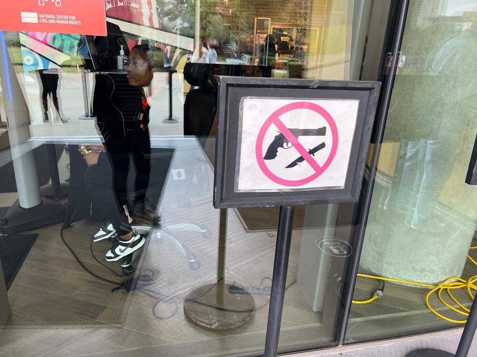 A sign prohibiting guns and knives outside of a museum in Atlanta.
