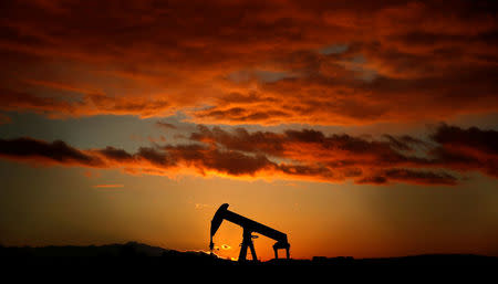 FILE PHOTO: An oil pump jack is seen at sunset in a field outside Scheibenhard, near Strasbourg, France, October 6, 2017. REUTERS/Christian Hartmann/File Photo