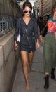 <p>In a denim dress, aviators leaving the Anna Sui fashion show during New York Fashion Week.</p>