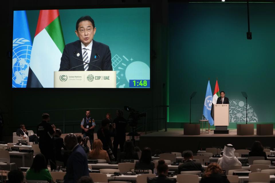 Japan Prime Minister Fumio Kishida speaks during a plenary session at the COP28 U.N. Climate Summit, Friday, Dec. 1, 2023, in Dubai, United Arab Emirates. (AP Photo/Peter Dejong)