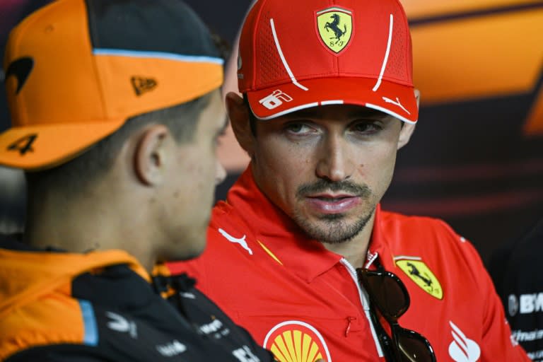 McLaren's Lando Norris (L) and Ferrari's Charles Leclerc attend a press conference at the Shanghai F1 circuit (Hector RETAMAL)