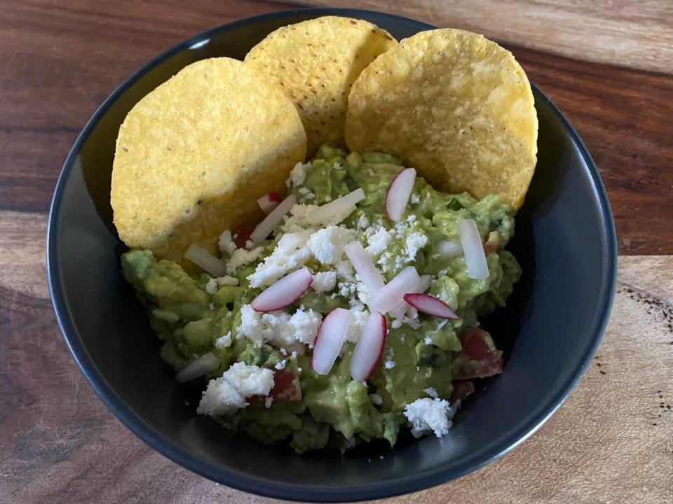 Aaron Sanchez's guacamole recipe with radish, queso fresco, and chips.