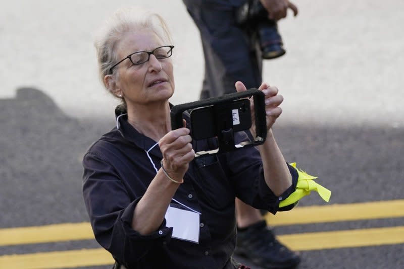 Annie Leibovitz stands on the street at the Global Climate Strike march in New York City on September 20, 2019. The photographer turns 74 on October 2. Photo by John Angelillo/UPI