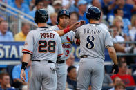 KANSAS CITY, MO - JULY 10: National League All-Stars Buster Posey #28 of the San Francisco Giants, Carlos Beltran #3 of the St. Louis Cardinals and Ryan Braun #8 of the Milwaukee Brewers score on a three-run triple by Pablo Sandoval #48 of the San Francisco Giants in the first inning during the 83rd MLB All-Star Game at Kauffman Stadium on July 10, 2012 in Kansas City, Missouri. (Photo by Jamie Squire/Getty Images)