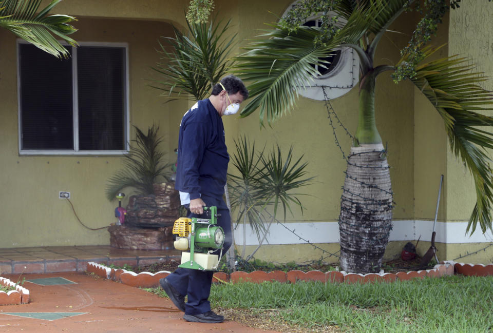 <p>Giraldo Carratala, an inspector with the Miami- Dade County mosquito control unit, sprays pesticide near a fountain, left, where mosquito larvae were found in standing water, Tuesday, April 12, 2016, in Miami, Fla. (AP Photo/Lynne Sladky)</p>