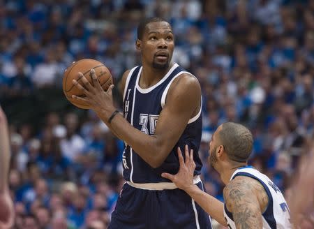 Apr 21, 2016; Dallas, TX, USA; Dallas Mavericks guard Devin Harris (34) guards Oklahoma City Thunder forward Kevin Durant (35) during the second half in game three of the first round of the NBA Playoffs at American Airlines Center. The Thunder defeated the Mavericks 131-102. Mandatory Credit: Jerome Miron-USA TODAY Sports / Reuters