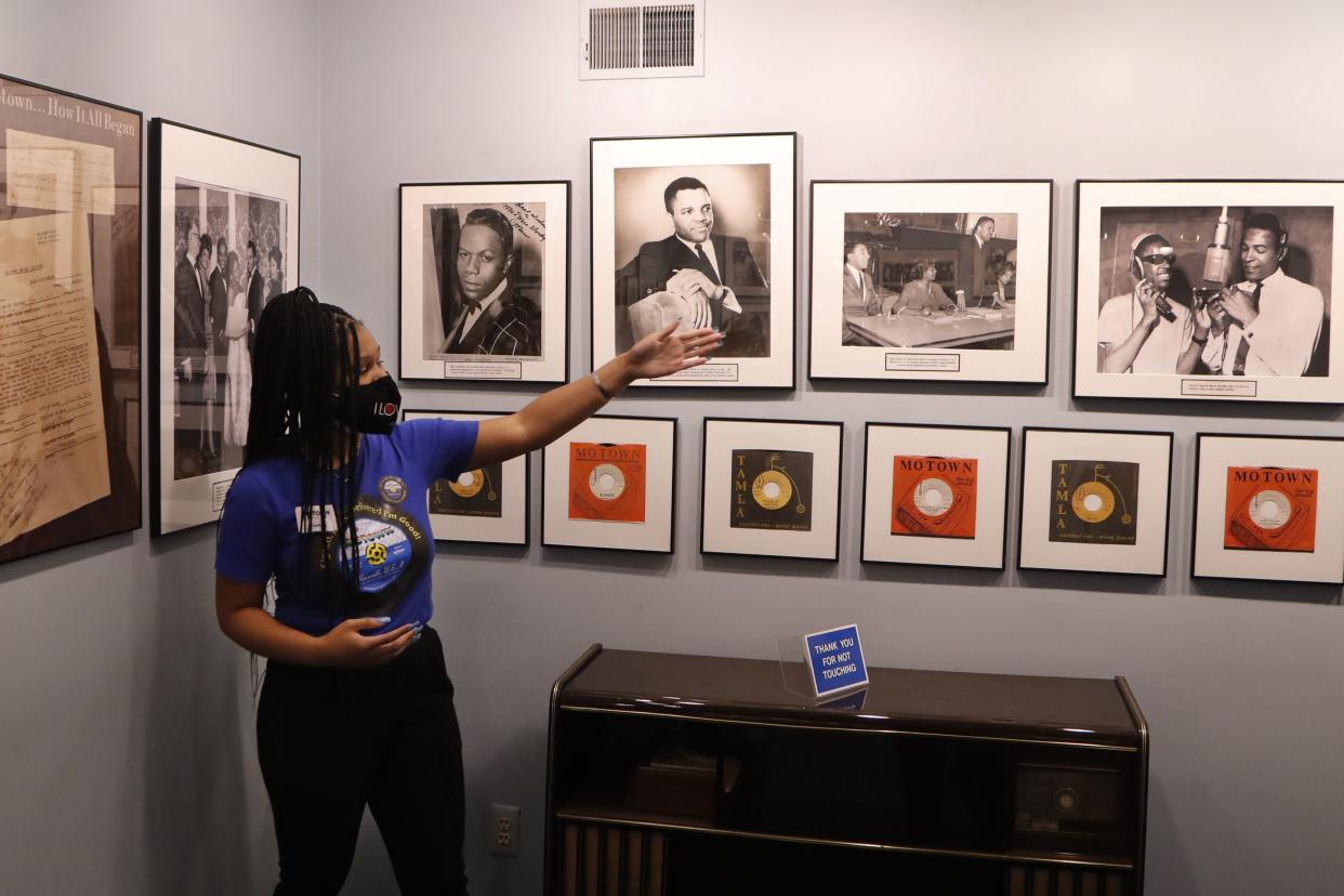 Motown Museum tour guide Jamia Henry points out notable Motown legends during a tour of the museum on Wednesday, July 15, 2020, in Detroit. The Detroit building where Berry Gordy Jr. built his music empire reopened its doors to the public on Wednesday. It had been closed since March due to the coronavirus pandemic.