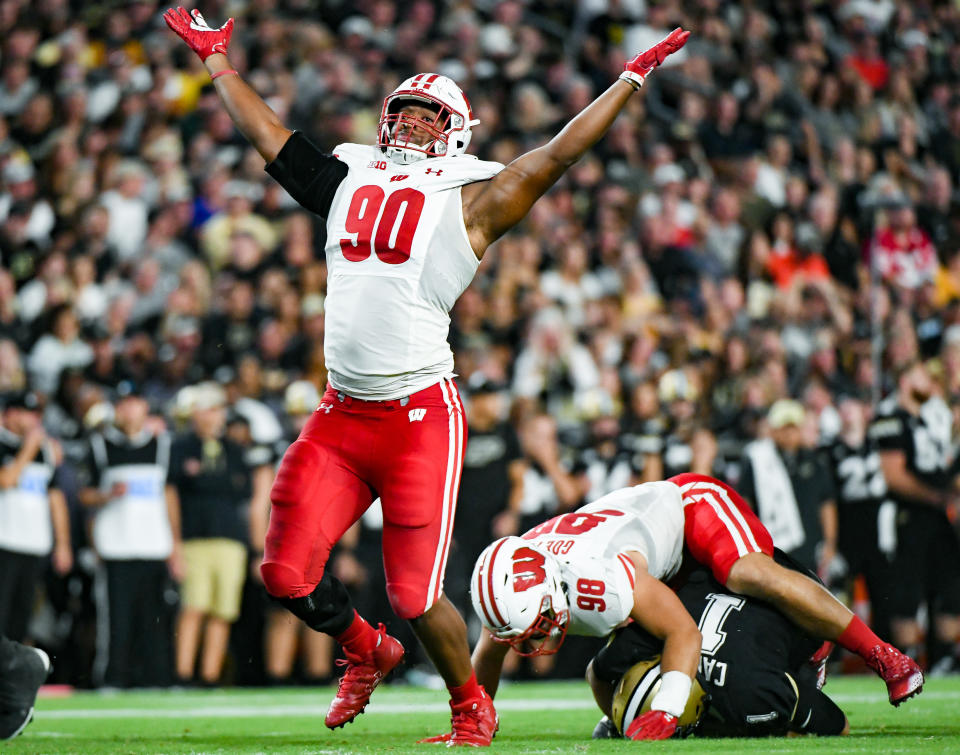 Sep 22, 2023; West Lafayette, Indiana, USA; Wisconsin Badgers defensive end James Thompson Jr. (90) celebrates after sacking Purdue Boilermakers quarterback Hudson Card (1) during the first half at Ross-Ade Stadium. Mandatory Credit: Robert Goddin-USA TODAY Sports