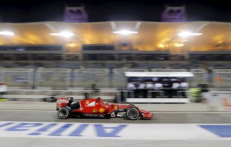 Ferrari Formula One Driver Kimi Raikkonen of Finland returns to the pit-lane during the second free practice ahead of Bahrain's F1 Grand Prix at Bahrain International Circuit, south of Manama, April 17, 2015. REUTERS/Hamad I Mohammed