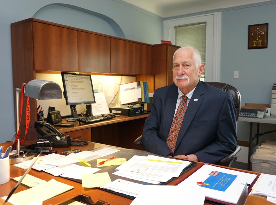 Longtime Clinton Community Schools teacher, principal and Superintendent David Pray is pictured in this file photo from June 30, 2015, sitting at his desk in the superintendent's office. Pray, who began his teaching career with Clinton in 1970 and retired from the district in 2013, died Thursday, April 18, 2024, at the age of 77.