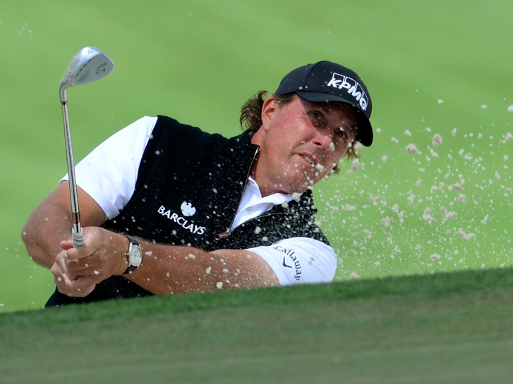 Phil Mickelson hits out of a bunker on the 7th hole during the first round of the 2016 The Masters golf tournament at Augusta National Golf Club, April 7, 2016.  Mandatory Credit: Michael Madrid-USA TODAY Sports/Files