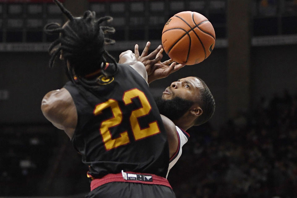 Grambling State's Prince Moss (22) is fouls Connecticut's R.J. Cole in the first half of an NCAA college basketball game, Saturday, Dec. 4, 2021, in Storrs, Conn. (AP Photo/Jessica Hill)