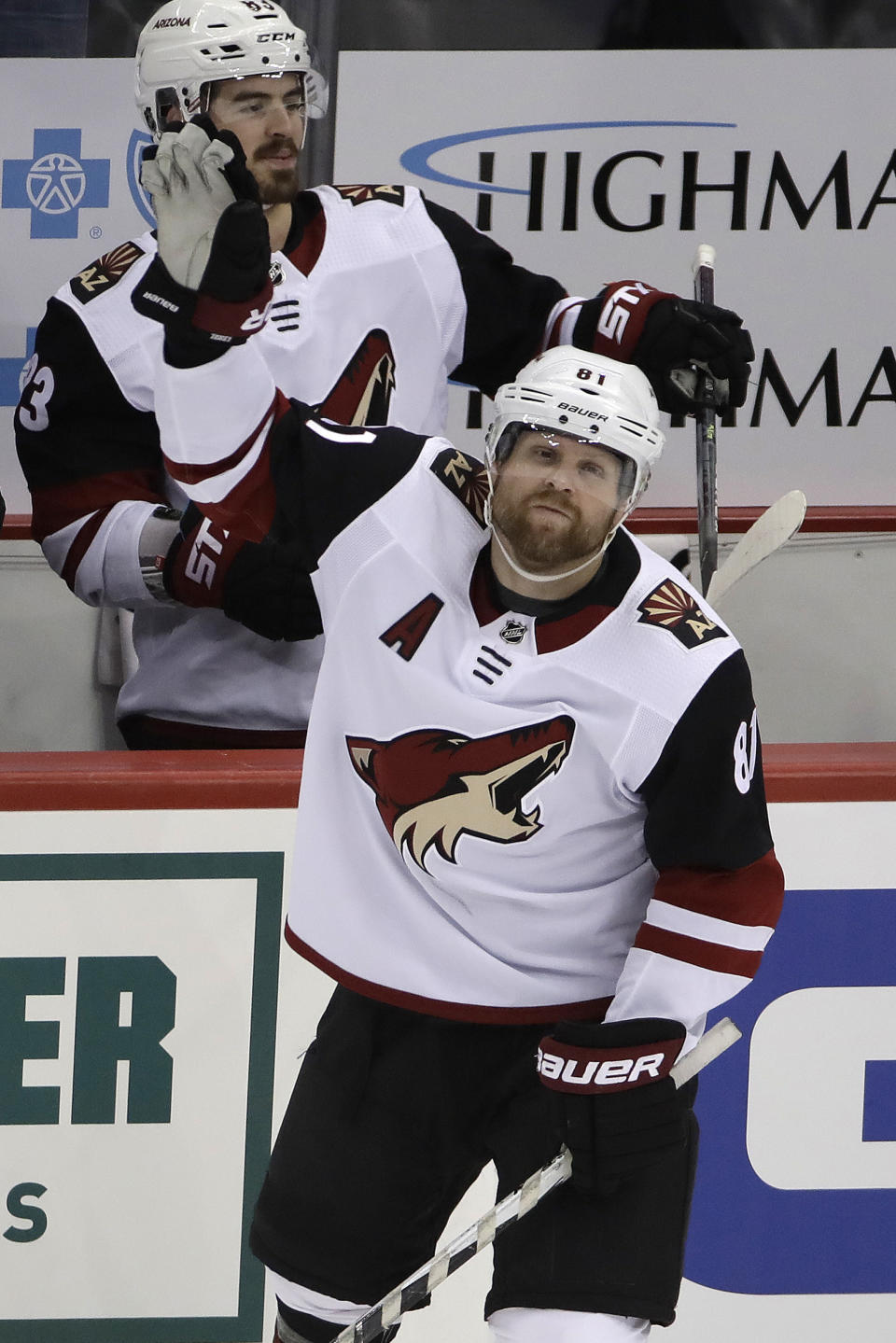 Two-time Stanley Cup Champion with the Pittsburgh Penguins, Arizona Coyotes' Phil Kessel (81) acknowledges fans during a tribute to his time with the Penguins during a timeout in the first period of an NHL hockey game against the Penguins in Pittsburgh, Friday, Dec. 6, 2019. (AP Photo/Gene J. Puskar)