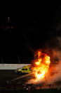 DAYTONA BEACH, FL - FEBRUARY 27: Safety workers try to extinguish a fire from a jet dryer after being hit by Juan Pablo Montoya, driver of the #42 Target Chevrolet, under caution during the NASCAR Sprint Cup Series Daytona 500 at Daytona International Speedway on February 27, 2012 in Daytona Beach, Florida. (Photo by Tom Pennington/Getty Images for NASCAR)