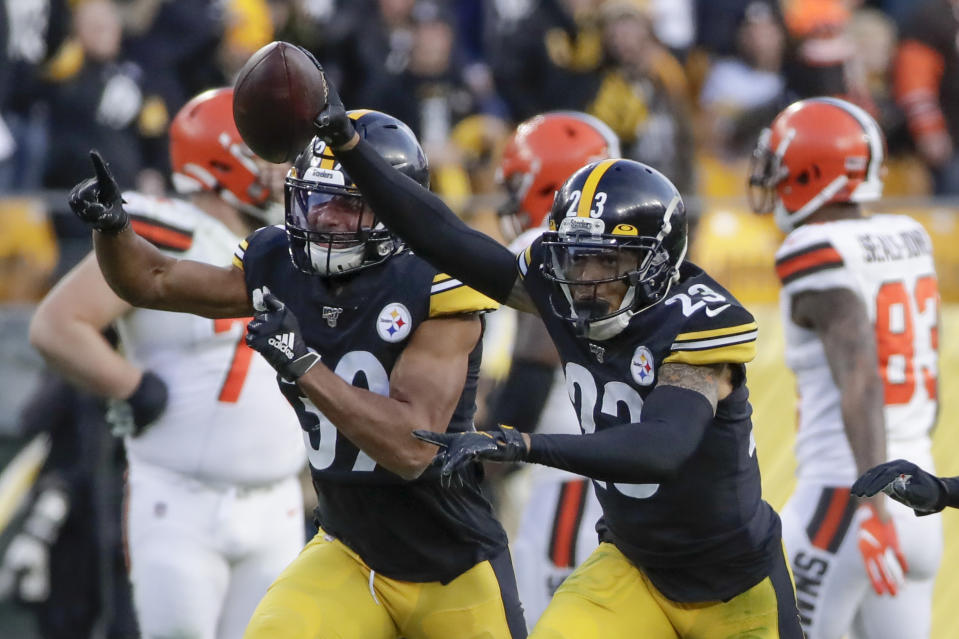 Pittsburgh Steelers cornerback Joe Haden (23),right, celebrates with free safety Minkah Fitzpatrick (39) after making an interception against the Cleveland Browns during the second half of an NFL football game, Sunday, Dec. 1, 2019, in Pittsburgh. (AP Photo/Gene J. Puskar)