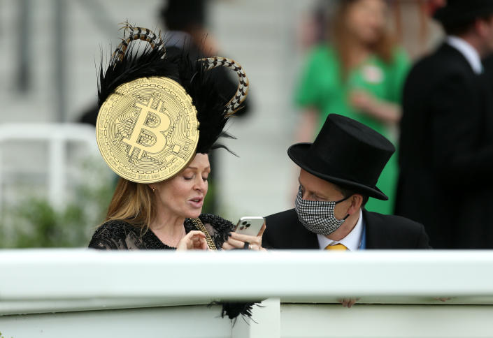 A racegoer wears a hat with a large bitcoin symbol on the side during day five of Royal Ascot at Ascot Racecourse. Picture date: Saturday June 19, 2021. (Photo by Steven Paston/PA Images via Getty Images)