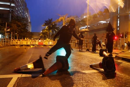 Anti-government protesters set up a roadblock during a demonstration in Tin Shui Wai in Hong Kong