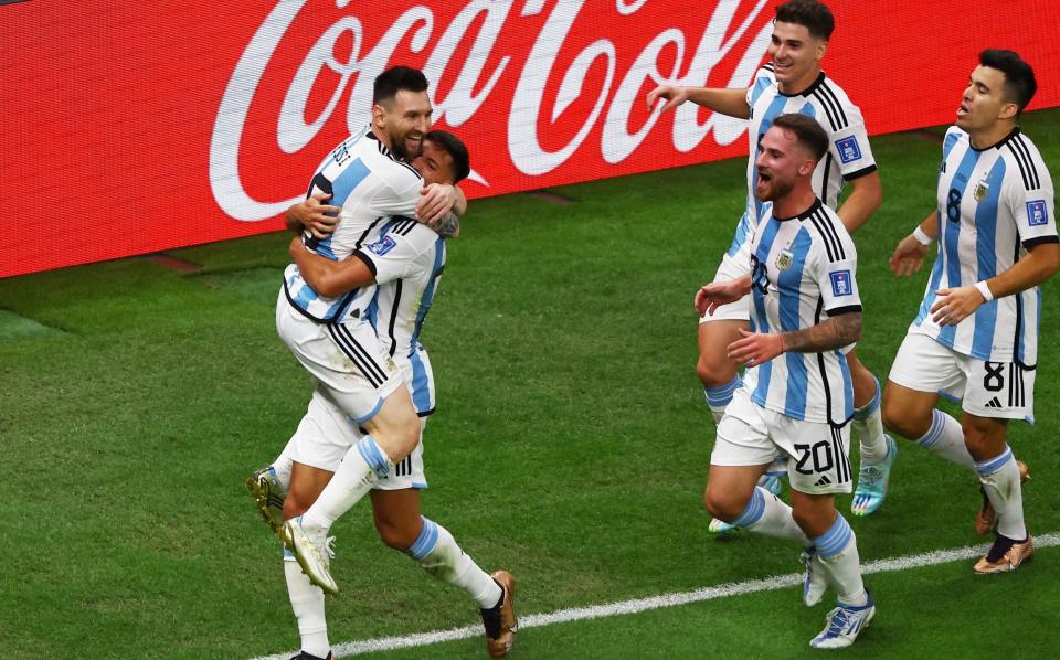 Argentina's Nahuel Molina celebrates scoring their first goal with Lionel Messi - REUTERS/Paul Childs