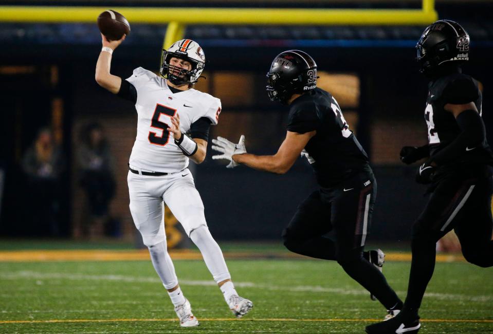 Republic's Wyatt Woods (5) makes a pass as the Tigers took on the Cardinal Ritter Lions in the Class 5 State Championship football game at Faurot Field in Columbia, Mo. on Friday, Dec. 1, 2023.
