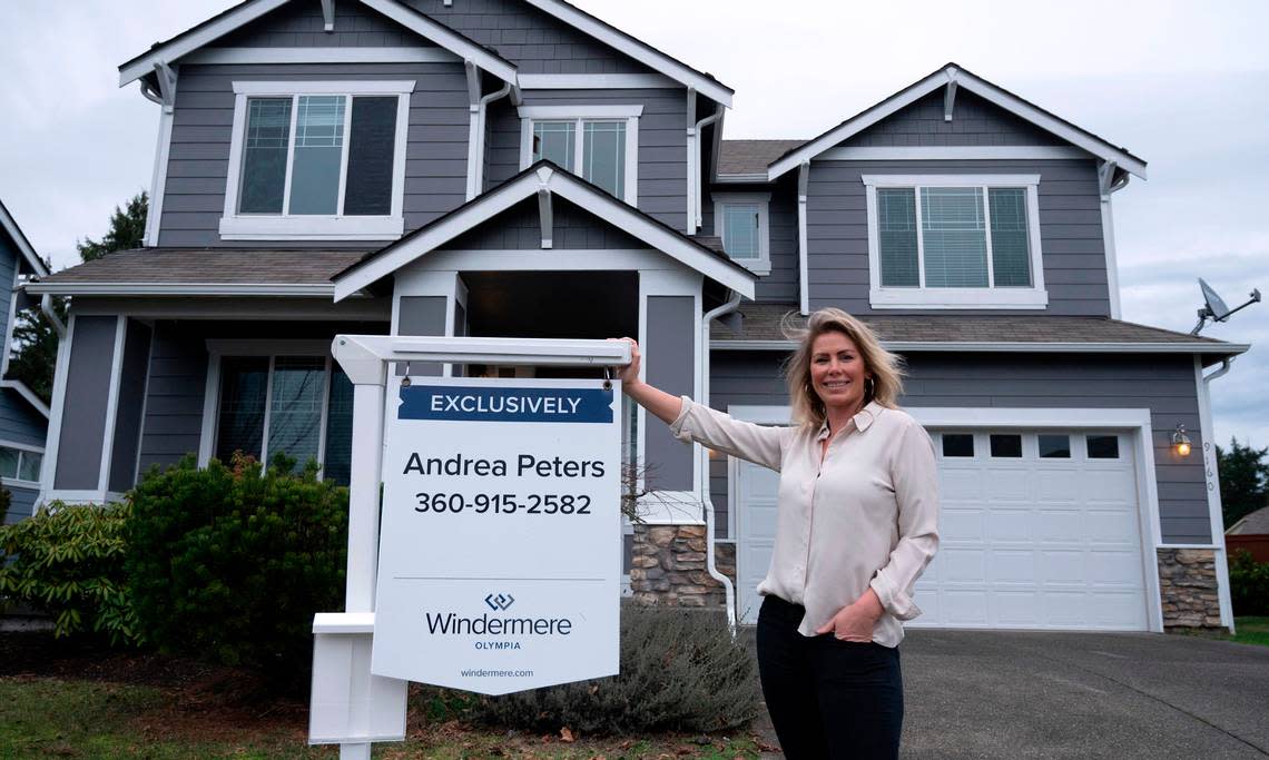Real estate broker Andrea Peters outside one of her home listings in Lacey, Washington, on Friday, Jan. 6, 2023. She says lower home prices, combined with higher interest rates have begun to level the market for buyers and sellers.